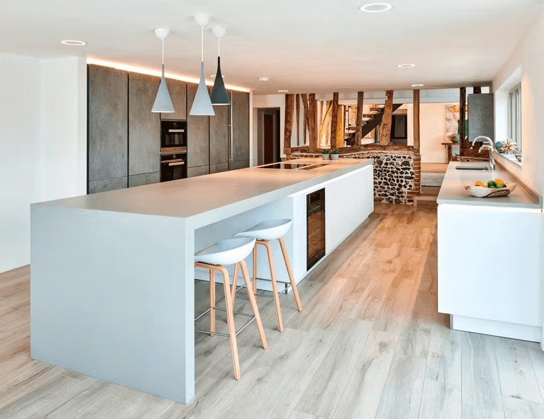Modern kitchen with light gray Silestone island and perimeter countertops